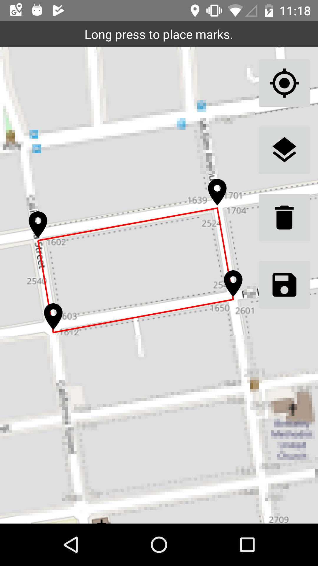 A map with four pins defining an area around a city block.