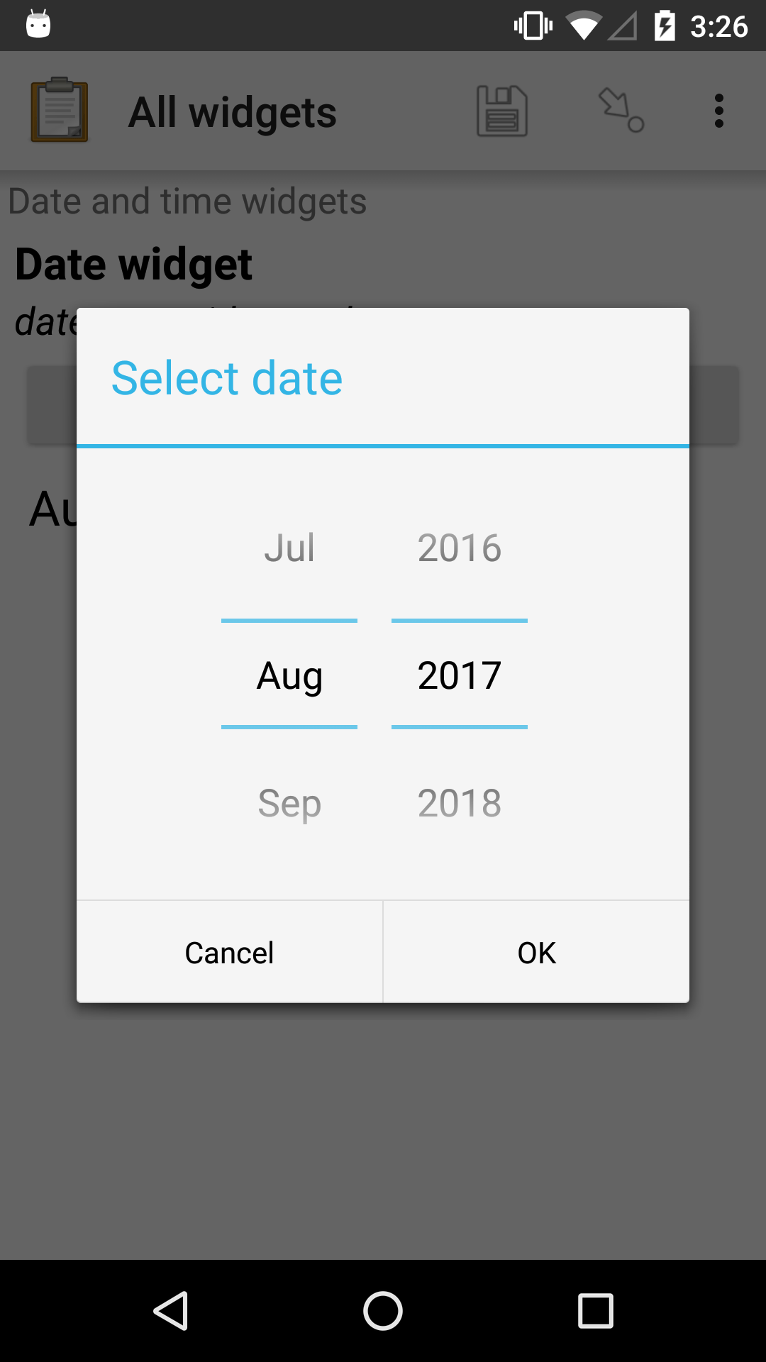 The date widget, with a modal popup labeled "Select date." There are individual "Spinner" type selectors for month and year, but not for date. At the bottom are Cancel and OK buttons.