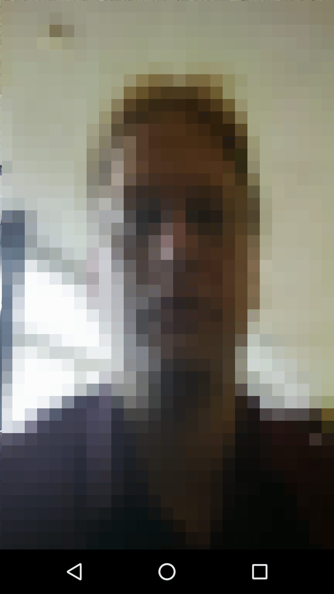 The camera screen on a device, taking a self-portrait of a person.